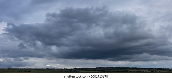 Storm clouds cover the landscape. Tragic gloomy sky. Panorama. Fantastic sky. - Powered by Shutterstock