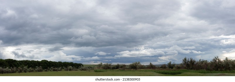 Storm clouds cover the landscape. Tragic gloomy sky. Panorama.  - Powered by Shutterstock