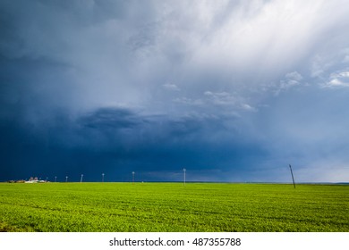 Storm clouds covering a corn field, bad weather coming