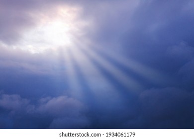 storm clouds, dark blue clouds, rays of the sun through the skylight, the concept of hope, faith, resurrection - Shutterstock ID 1934061179