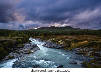 Storm Clouds Developing over Rushing River