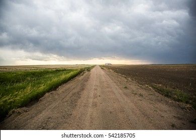 Storm clouds with a dirt road in rural America