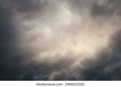 Storm clouds gather, creating a dramatic and moody overcast sky                               