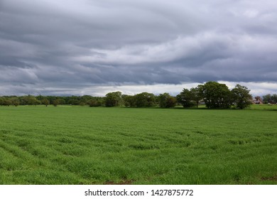 Storm Clouds Gather Over Lancashire Farmland In Northern England.