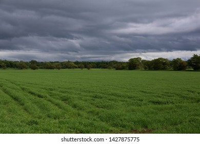 Storm Clouds Gather Over Lancashire Farmland In Northern England.