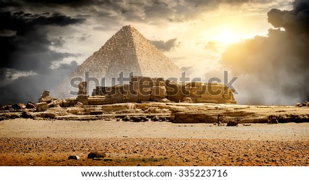 Storm clouds over pyramid of Cheops in Giza