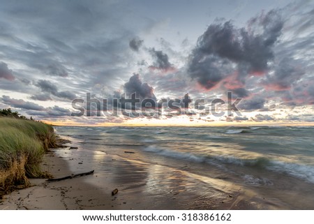 Storm Clouds Over a Sandy Beach at Sunset - Grand Bend, Ontario, Canada