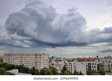 Storm clouds and rain over the city. Top view with blocks, neighborhoods and houses under storm clouds. Rain and storm in Bucharest, aerial photo with colorful buildings - Powered by Shutterstock