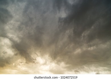 Storm clouds in the sky at sunset as background