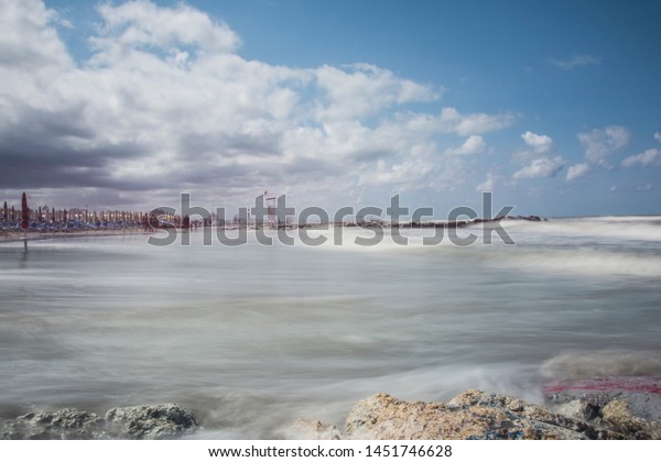 \
Storm clouds with stormy sea and rescue\
tower in the third part\
background