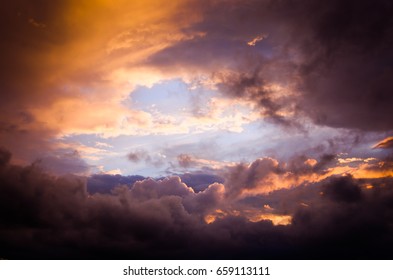 Storm clouds in the sunset light in the summer