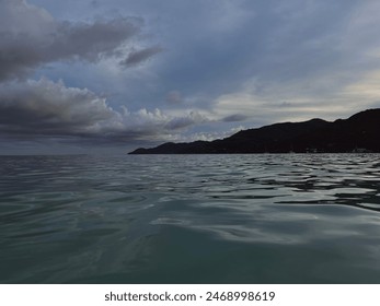 Storm clouds at sunset over the ocean