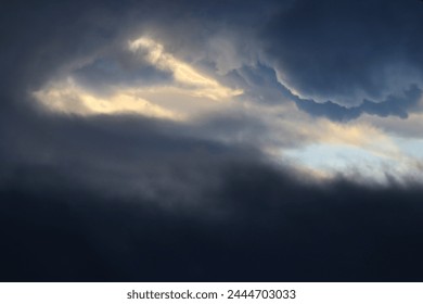storm clouds in sunset sky - Powered by Shutterstock