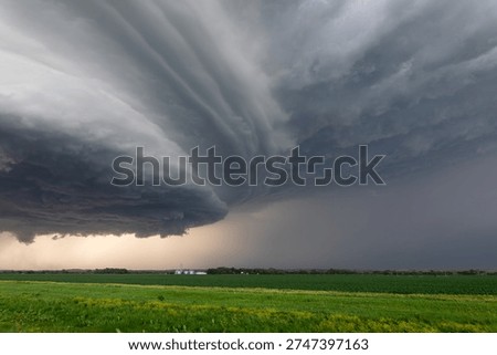 Storm clouds from a supercell thunderstorm over a field in Nebraska