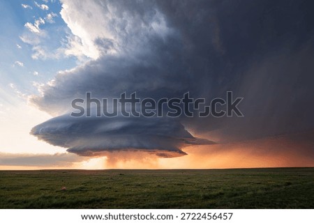 Storm clouds from a supercell thunderstorm at sunset in New Mexico