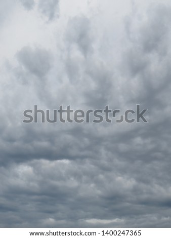 Storm clouds twisting their abstract morphology as the storm's fury intensifies with bulges and dark enigmatic patterns.   