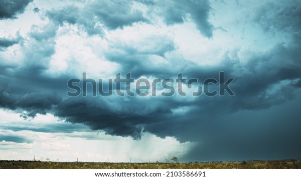 Storm Cloudy Rainy Sky. Dramatic Sky With Dark Clouds
In Rainy Day. Storm And Rain Above Summer Field. Time Lapse,
Timelapse, Time-lapse. Hyper lapse 4K. Agricultural And Weather
Forecast Concept. Bad
