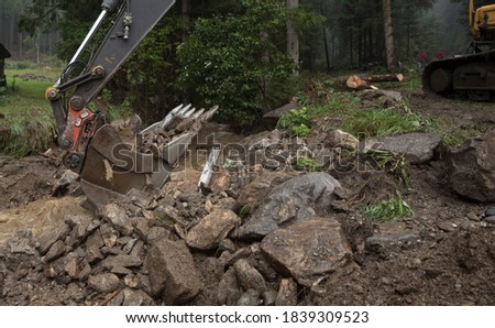 storm damage caused by mudslides, debris and mud after heavy rainfalls