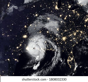 Storm Laura Over USA At Night, Tropical Hurricane Eye From Space. Typhoon Landfall And City Lights Of Earth On Satellite Photo. Weather And Warning Concept. Elements Of This Image Furnished By NASA.