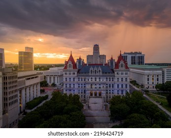 Storm and rain clouds have just passed over the New York State Capitol leaving a stunning colorful sunset in Albany - Shutterstock ID 2196424719