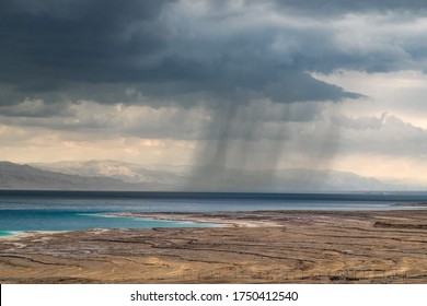 Storm And Rain At Dead Sea Coastline. Salt Crystals At Sunset. Texture Of Dead Sea. Salty Sea Shore