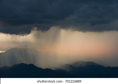  
Storm Rain Is Falling Down In Mountain Range At Sunset In Tropical Rain Forest .Rain Cloud.There Is Light And Hope At The End Of The Tunnel,positive Thinking Concept.