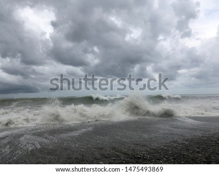 Storm at sea, storm warning on the coast. Thunderclouds and big sea waves during a storm. - image