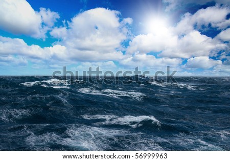Storm sea with white horses on waves