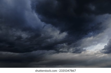 storm sky, dark dramatic clouds during thunderstorm, rain and wind, extreme weather, abstract background