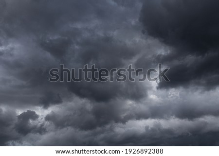 Storm sky with dark grey cumulus clouds background texture, thunderstorm