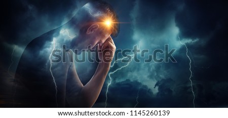 Storm sky with lightning and sun on the background of the silhouette of a man. Concept on the problem of personality, psychology, psychiatry. Medical diseases (migraine and headache pain). 