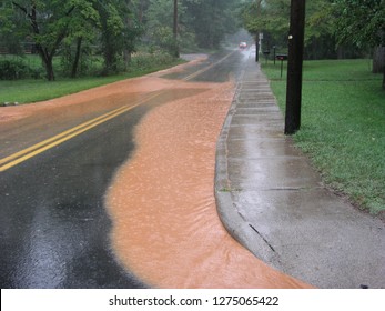 Storm Water Runoff On Road After Heavy Rain In North Carolina 