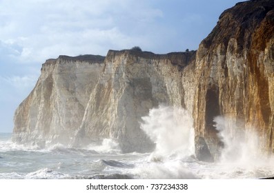 Storm Waves Crashing Against Chalk Cliffs In East Sussex, UK