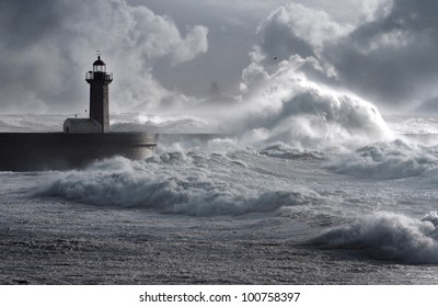 Storm waves over the Felgueiras Lighthouse in a cloudy day, Oporto, Portugal.
