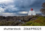 Stormclouds  and rain over Amphitrite Lighthouse