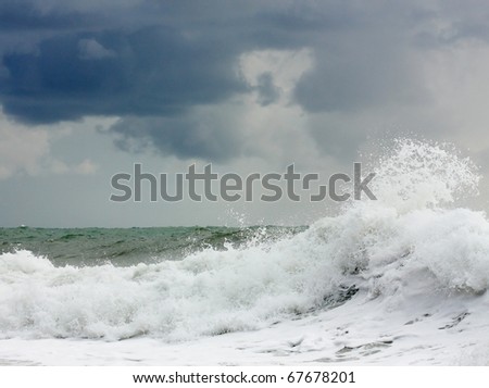 Storming sea with a thundercloud above