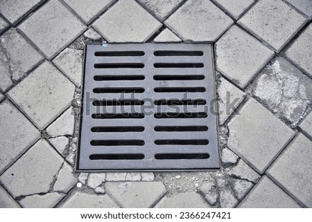 Stormwater drainage on city streets, street separation stormwater drainage, for drainage and separation of water from lawn and pavement. Drainage system for meltwater, rainwater flows and floods