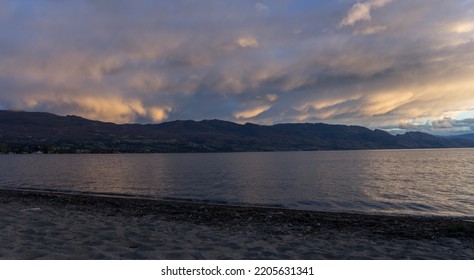 Stormy Clouds Over Okanagan Lake At Sunset