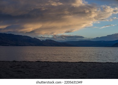 Stormy Clouds Over Okanagan Lake At Sunset