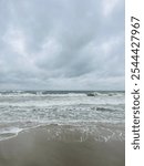 stormy cloudy seascape, waves at the sea, rainy clouds