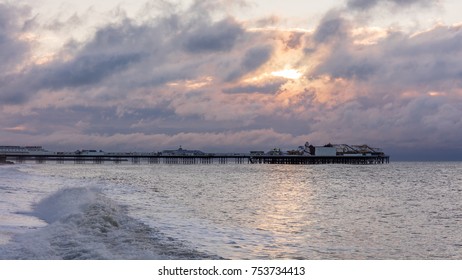 A Stormy Dawn Sky Over The Palace Pier, Brighton, UK.