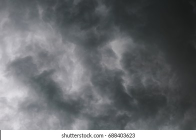 Stormy grey dramatic clouds in the daytime sky before thunderstorm - Powered by Shutterstock - Get 15% off with code: PIKWIZARD15