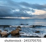 Stormy Morning Sunrise over Lake Taupo, New Zealand with Rainbow