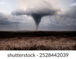 Stormy panorama featuring a tornado over agricultural plains, illustrating climate change