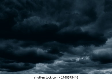 Stormy rain big fluffy clouds. Dark sky. Natural scenic abstract background. Weather changes backdrop. Sky filled with voluminous clouds.