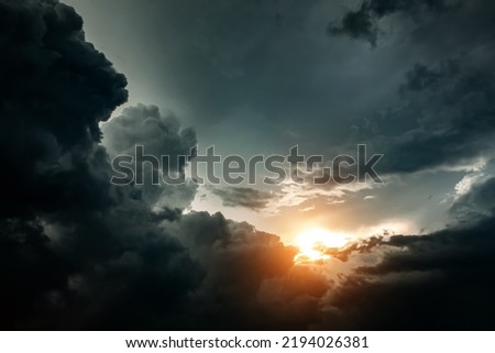 Stormy Rain Clouds Background with a Light