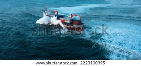 Stormy sea with Container ship delivering cargo at sunset