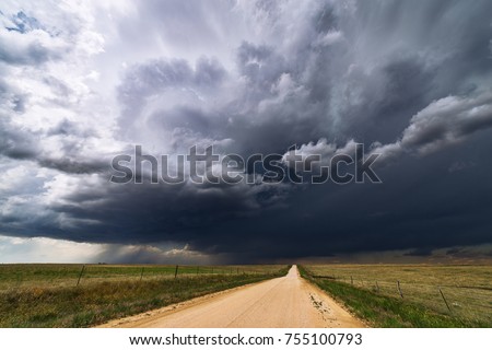 Stormy sky and dirt road