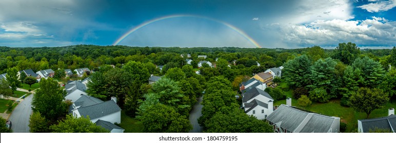 Stormy Suburban Sky With Rainbow  After The Rain Over A Suburban American Neighborhood