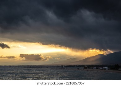 Stormy Sunset Over The Lake